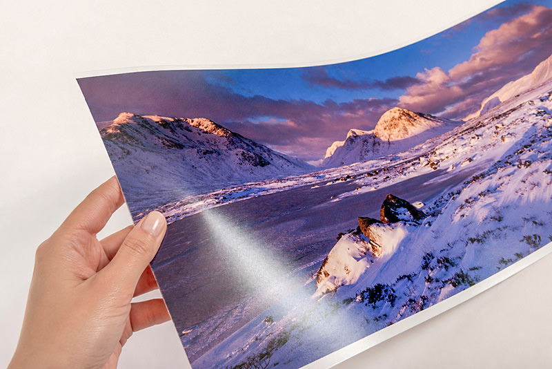 A lustre print held to the light