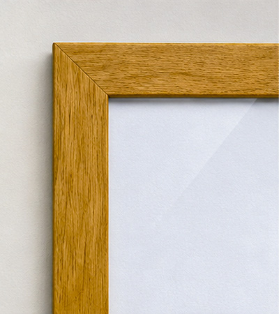Corner detail of a light oak wood frame